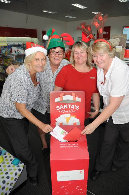 Trish Allen, Virginia Brown, Rozz Spittles and Louise Taylor from the Dubbo Post Shop look forward to helping get letters to Santa Claus. 		     Photo: BELINDA SOOLE