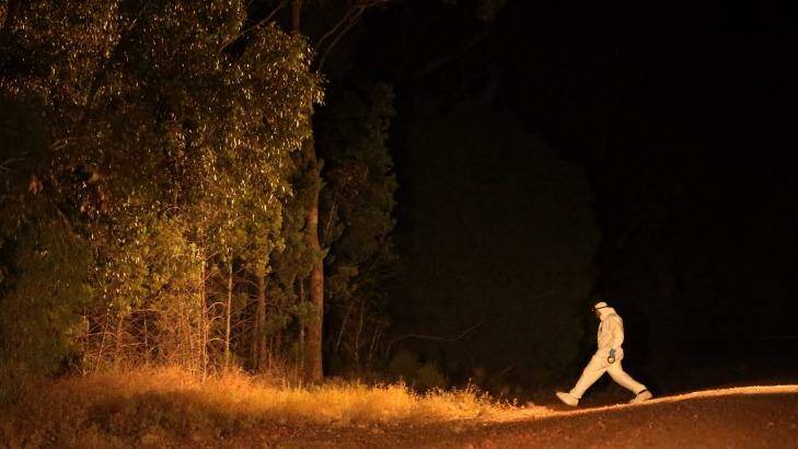 A forensic officer walks into Cocoparra National Park, where Stephanie Scott's body was found. Photo: Kate Geraghty