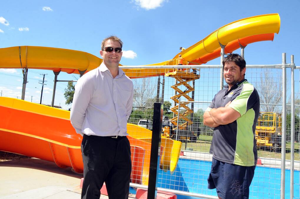 Dubbo City Council sporting facilities manager Wes Giddings and Dubbo Aquatic Leisure Centre manager Nick Wilson with the replacement twin water slides on track for use this summer.	       Photo: BELINDA SOOLE