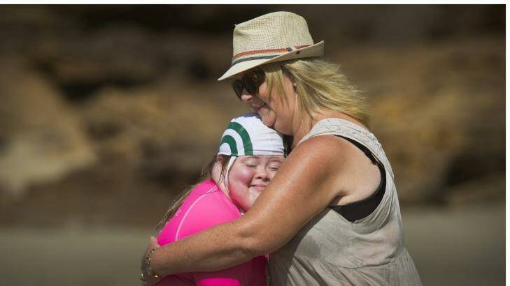 Georgia Brown, 12, and her mum Caroline. Georgia is part of Starfish Nippers program run at the Anglesea Surf Life Saving club for young people with disabilities. Photo: Simon O'Dwyer