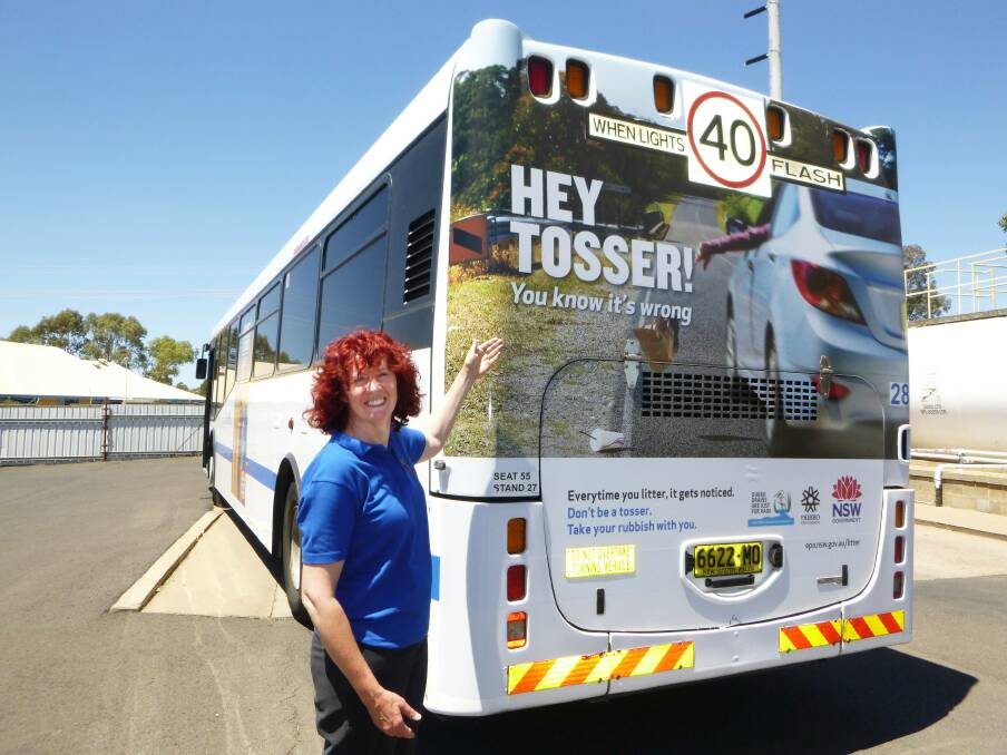 Dubbo City Council s Stormwater Education Officer Karen Hagan says the Hey Tosser! message on Dubbo Busline buses will be hard to miss.	Photo: CONTRIBUTED