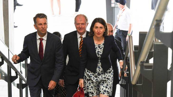 Andrew Constance, left, Sydney Trains chief executive Howard Collins and Premier Gladys Berejiklian at Leppington on Monday. Photo: Peter Rae