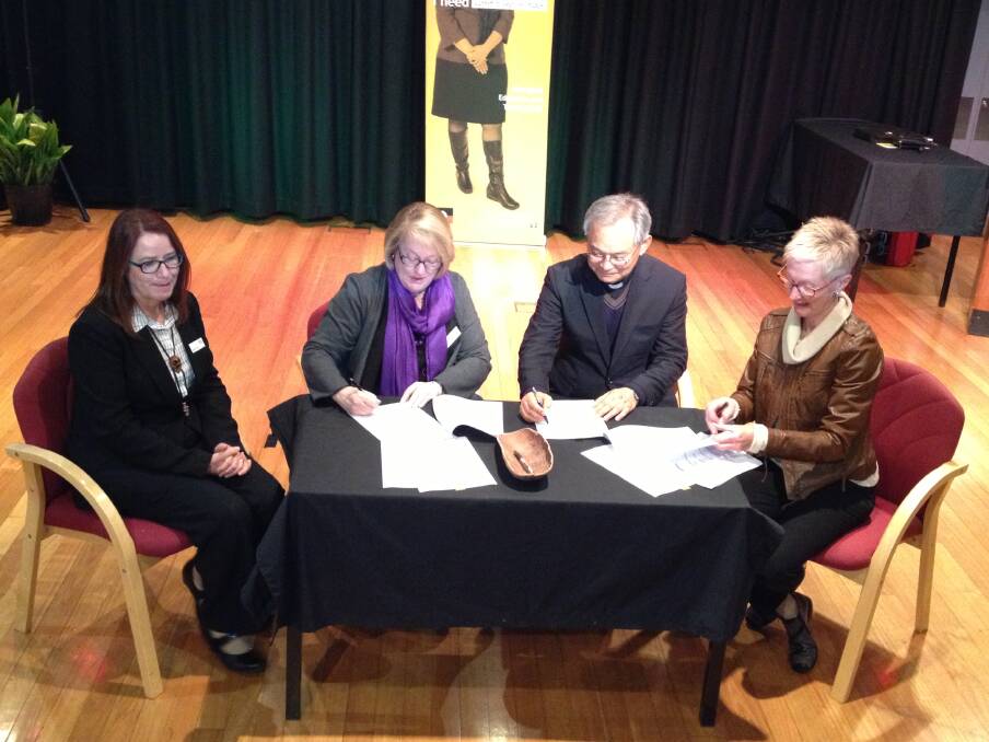Susan Carey (Director VET Delivery, TAFE Western), Kate Baxter (Institute Director, TAFE Western), Fr. Gabriel Chung (President of CSC) and Felicity Taylor-Edwards (CEO, RDA Orana) signing their MOU. Photo: CONTRIBUTED
