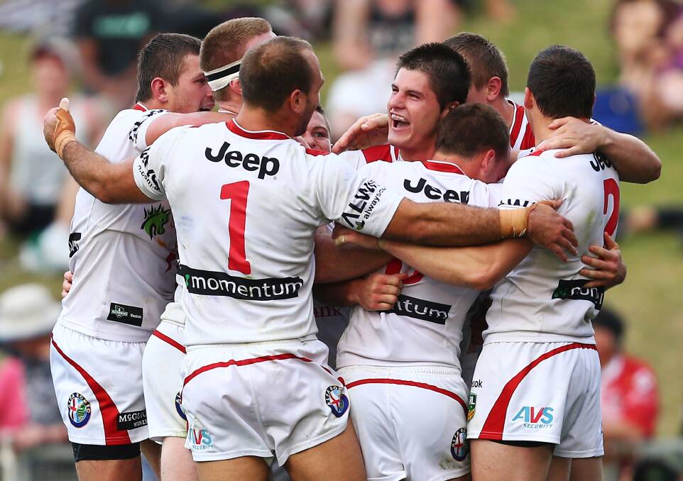 Charly Runciman (centre) is hoping for a big 2015 with the Dragons despite missing out on a place in the squad for the Auckland Nines next week.  
Photo: Getty Images