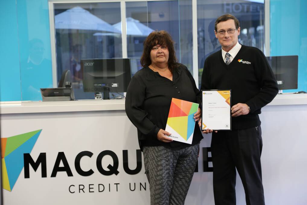 Meegan Trudgett with Macquarie Credit Union general manager Matthew Bow.    Photo: CONTRIBUTED