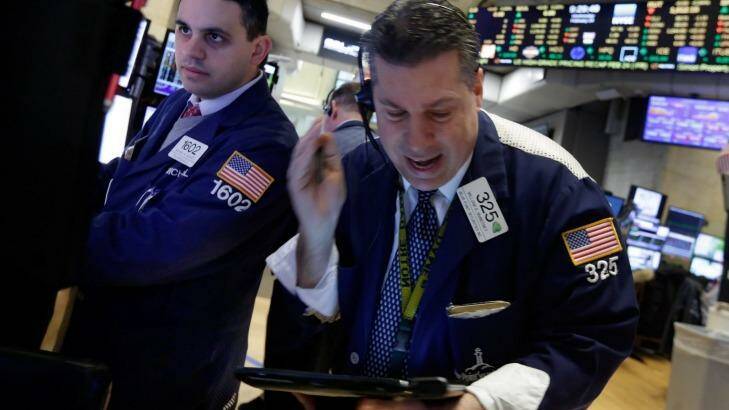 Traders working the floor of the New York Stock Exchange: Rather than punting on central bankers' next steps, it's time to focus again on companies' performance, top fund manager says. Photo: Richard Drew
