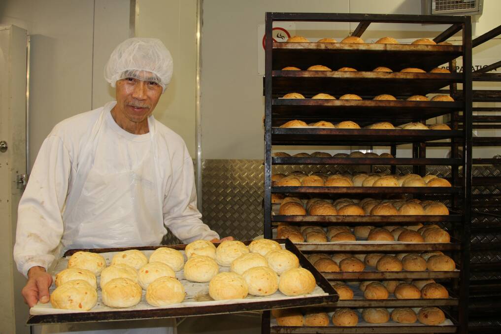 Ken with some rolls he prepared.