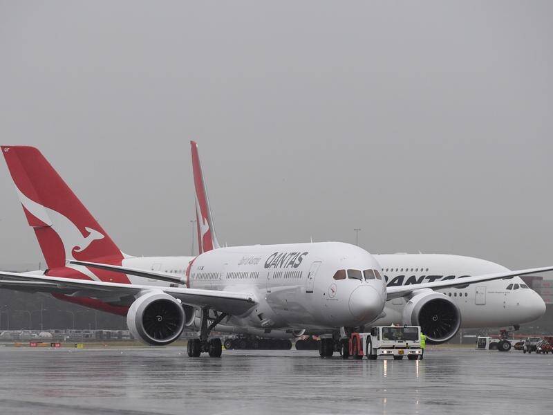 Qantas has lifted first-half profit 18 per cent to $607 million.