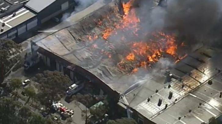 Fire destroys a furniture warehouse in Yennora. Photo: Channel Nine