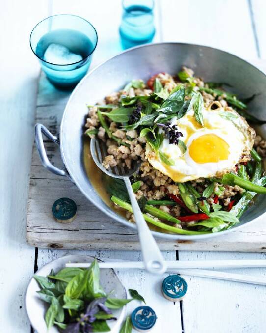 Neil Perry's minced pork with chillis, Thai basil and fried egg <a href="http://www.goodfood.com.au/good-food/cook/recipe/minced-pork-with-chillies-thai-basil-and-fried-egg-20141013-3hvab.html"><b>(recipe here).</b></a> Photo: William Meppem