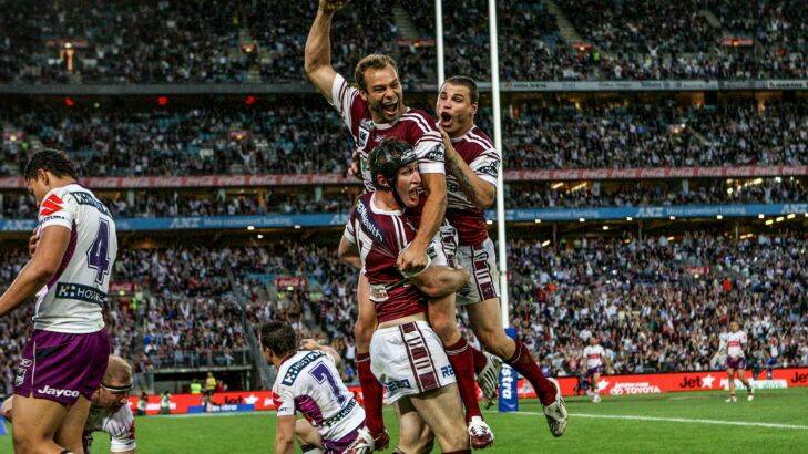 SMH SPORT ANDREW WEBSTER COLUMN Steve Menzies (headgear) celebrates with Brett Stewart and Anthony Wafmough after scoring a try in his final game for Manly in the 2008 NRL Grand Final between the Manly Sea Eagles and Melbourne Storm. Photograph Dallas Kilponen