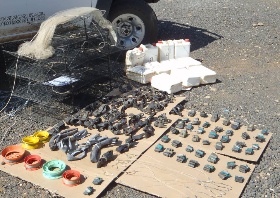 Fisheries Officers apprehended four men on the Macquarie River and seized 90 rigged handlines, 11 drift lines, one monofilament cast net, seven prohibited traps and 23 live carp.