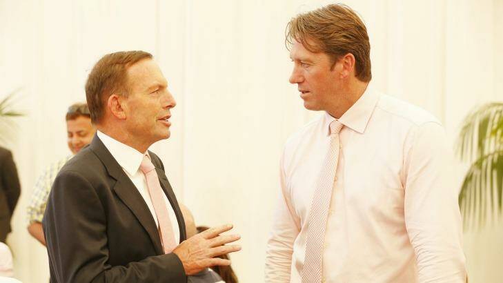 Busy man: Tony Abbott talks to Glenn McGrath on Jane McGrath day at the SCG. Photo: James Brickwood