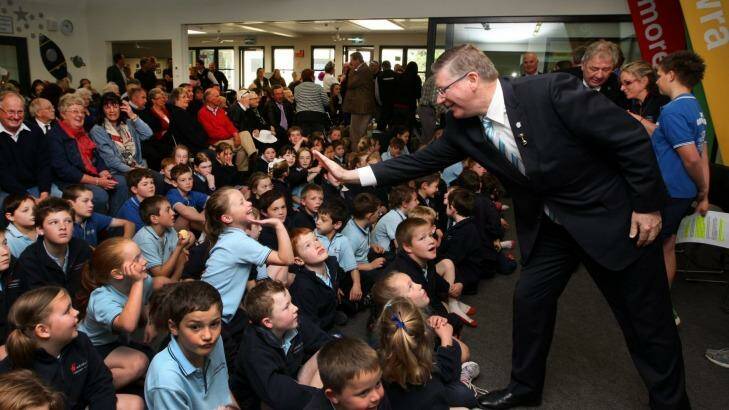 Premier Denis Napthine high fives students at the opening of Woolsthorpe Primary School. Photo: Leanne Pickett
