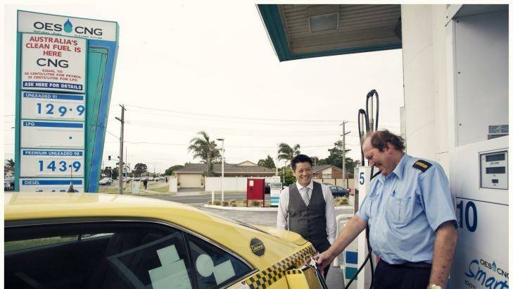 Good value: Tuyen Hua, left, of OES CNG SmartGas, watches as Eastmorr Taxis driver Robert Howard fuels up. Photo: Meredith O'Shea