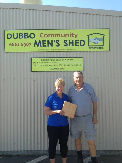 Dubbo Make A Wish secretary Sharyn Hunter and Dubbo Community Men s Shed president Phil Knight with the wooden platters that will be sold after the lunch.				       Photo: CONTRIBUTED