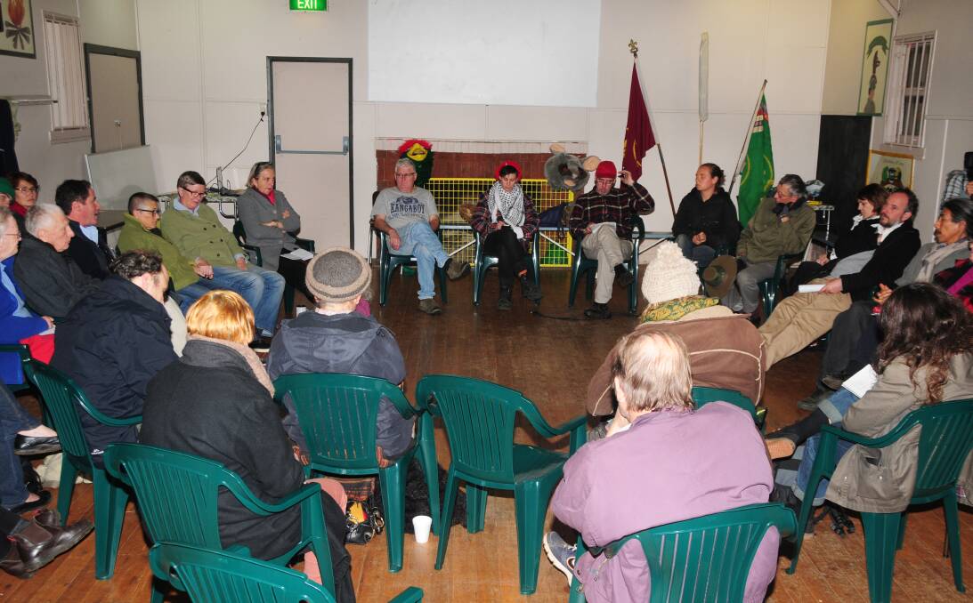 Greens NSW Senator Lee Rhiannon (back left in a grey coat) tries to keep warm during a fiery meeting on the Dubbo Zirconia Project hosted by Friends of the Earth. 	Photo: JACKIE PRATTEN