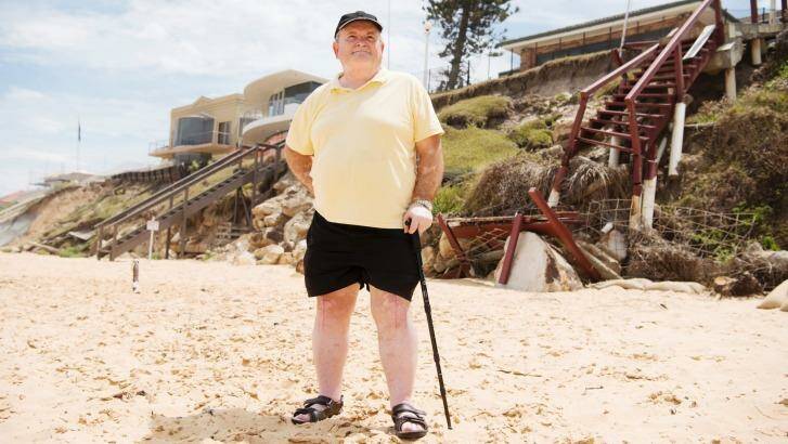 Pat Aiken, a regional co-ordinator of the NSW Coastal Alliance, near damaged properties at Wamberal. Photo: James Brickwood