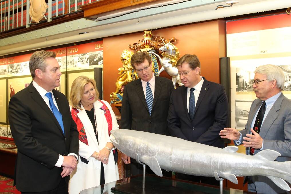 NSW Minister for Industry, Resources and Energy Anthony Roberts, director and chief executive officer of the Australian Museum Kim McKay, Member for Orange Andrew Gee, Deputy Premier and Member for Dubbo Troy Grant and Geological Survey of NSW s Dr Ian Percival check out the state s new fish fossil emblem. 										    Photo: Contributed