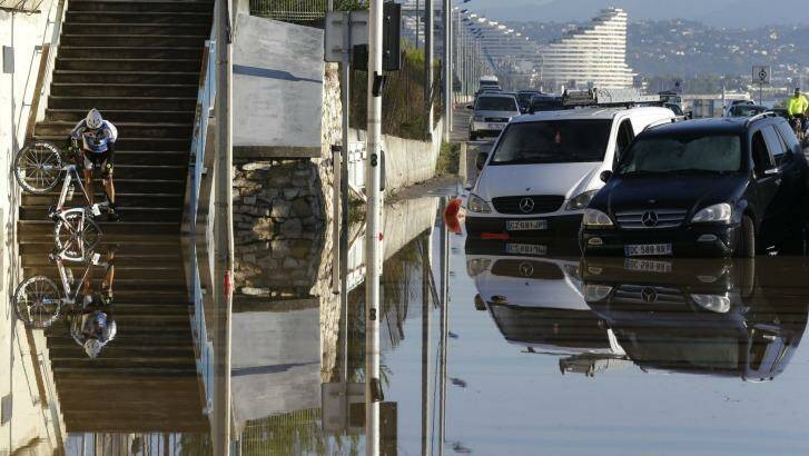 A man tries to make his way after floods hit Biot, near Cannes. Photo: Lionel Cironneau