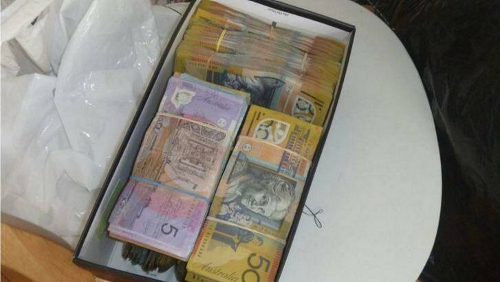 Police allegedly found $300,000 in cash during the raid. Photo: NSW Police