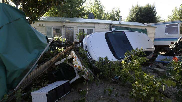 Debris and a damaged car are pictured in the campsite of Biot, near Cannes. Photo: Lionel Cironneau