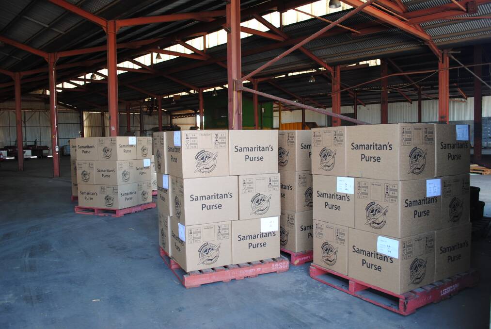 Seven pallets of cartons containing gift-filled shoeboxes for needy children before they were taken to Sydney by Robert Holmes Transport. Photo contributed.