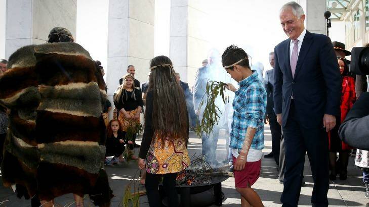 Prime Minister Malcolm Turnbull during the smoking ceremony at the welcome to country ceremony on the forecourt to mark the opening of the 45th Parliament, at Parliament House in Canberra. Photo: Alex Ellinghausen