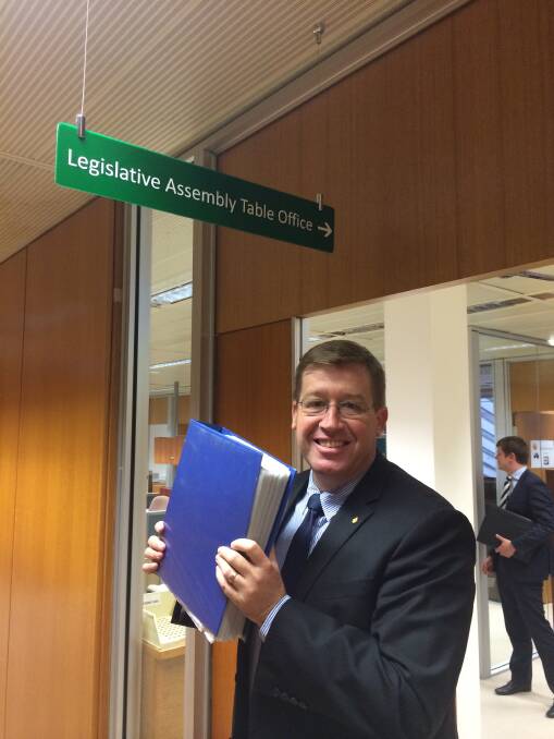 Dubbo MP Troy Grant with the Save Playmate Cottage petition. Photo supplied.
