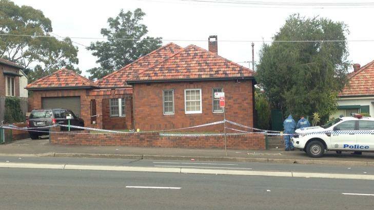 The house remained cordoned off with police tape on Sunday morning.