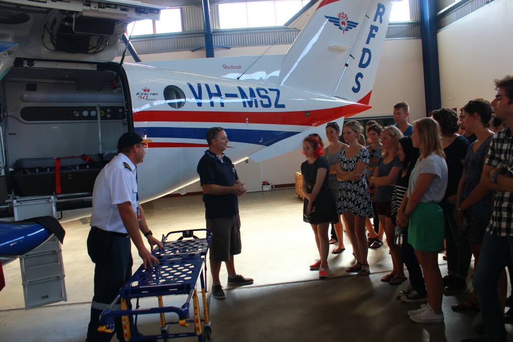 RFDS Dubbo Base Manager Darren Schiller and RFDS pilot Captain James Brown demonstrating the features of the plane to the University of Sydney medical students.