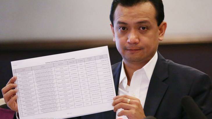Philippine senator and vice presidential candidate Antonio Trillanes IV shows alleged joint bank account records by presidential candidate Rodrigo Duterte and his daughter Sara at a foreign correspondents forum on Tuesday. Photo: Aaron Favila