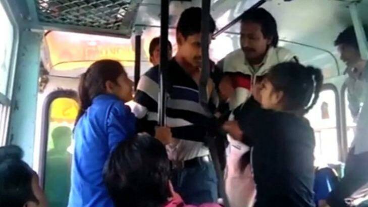 The sisters fight back against their alleged attackers on the bus in India.   Photo: YouTube