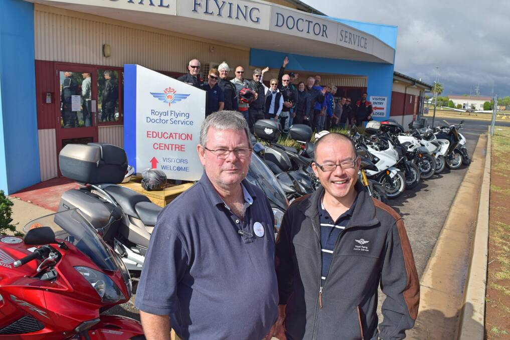 Bright Smiles organiser Bill Patrick (left) and his fellow riders are greeted by TOOTH program dentist Dr Kah Chong at the Royal Flying Doctor Service South Eastern Section Dubbo Base at the weekend. 	Photo: CONTRIBUTED