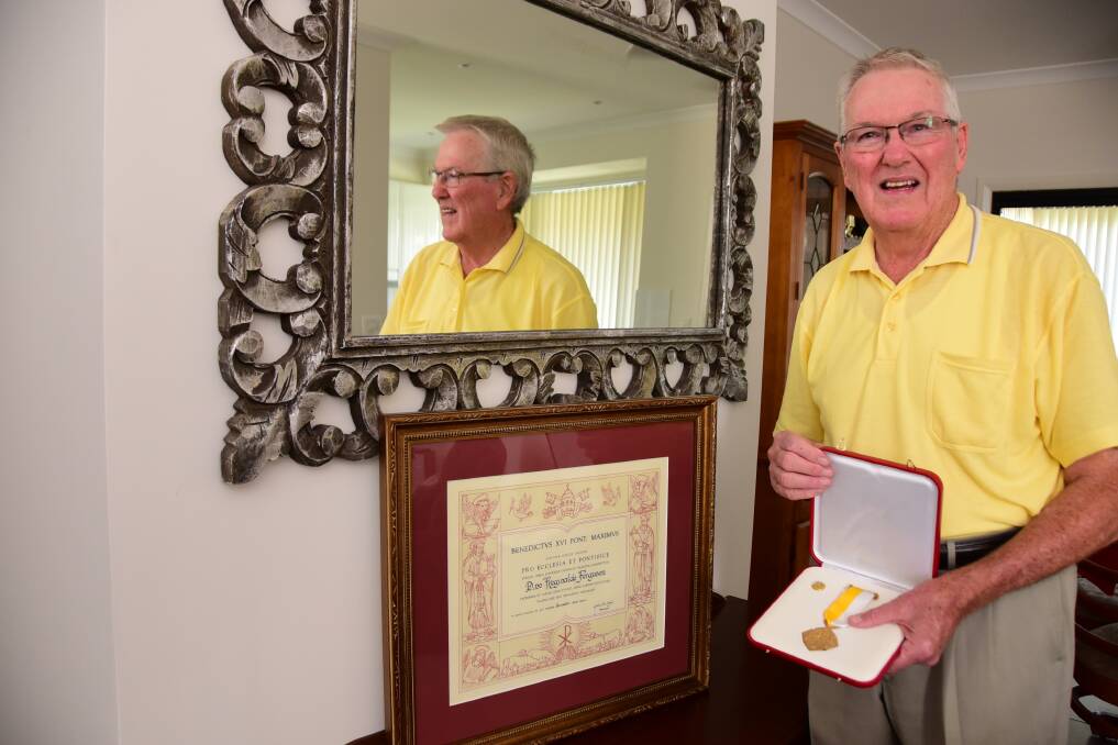 Reg Ferguson with the Papal honours he received in recognition of his service to the Dubbo community and Catholic Church.    Photo: BELINDA SOOLE