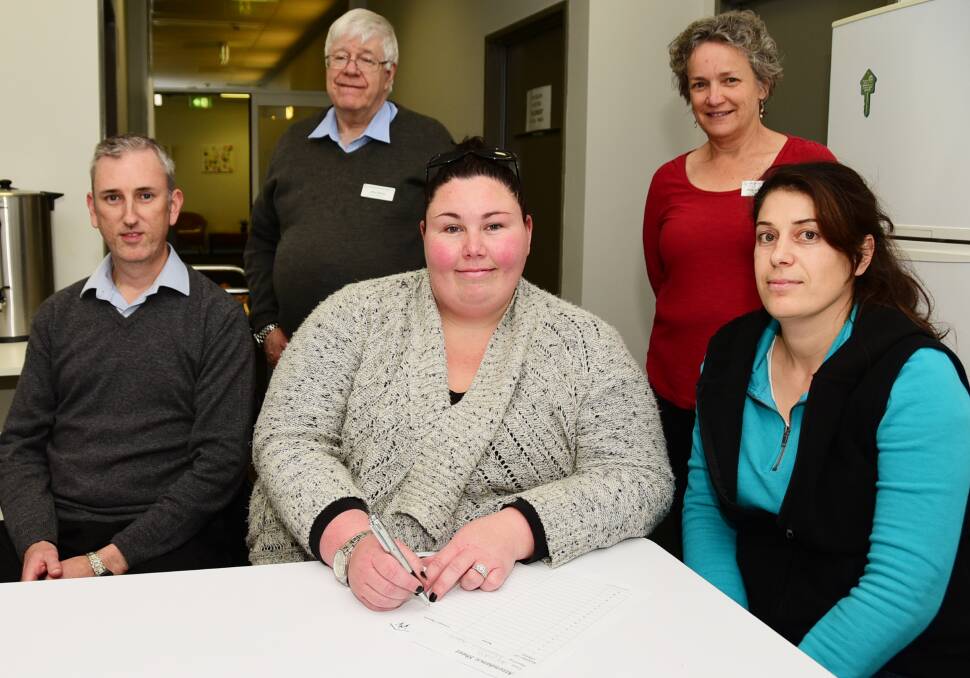 Patrick O'Callaghan, Teagan Martin and Sumia Karam (front) with Alex Burns and Henriette de Jong (back) at the migration agent information session hosted by Dubbo Neighbourhood Centre. 	       Photo: BELINDA SOOLE