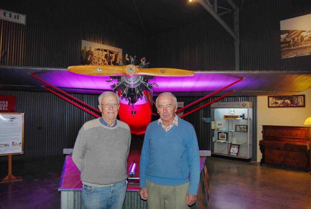 Narromine Aviation Museum committee member Peter Kierath and committee chairman Bob Richardson with the locally-built 1938 Corben Super Ace, recently restored by the Men's Shed. It is one of the centrepieces of the new display in the extension of the Narromine Aviation Museum. 																 Photo: FAYE WHEELER