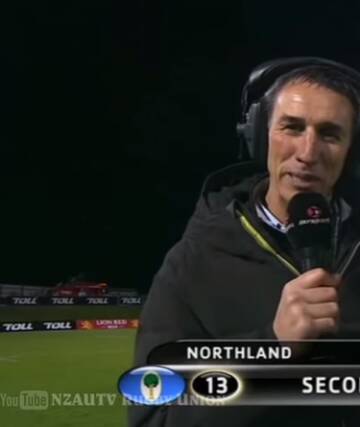 Deflategate: Rugby commentator Ian Jones holds the popped rugby ball that Southland flanker Tim Boys scored with Photo: YouTube/NZAUTV