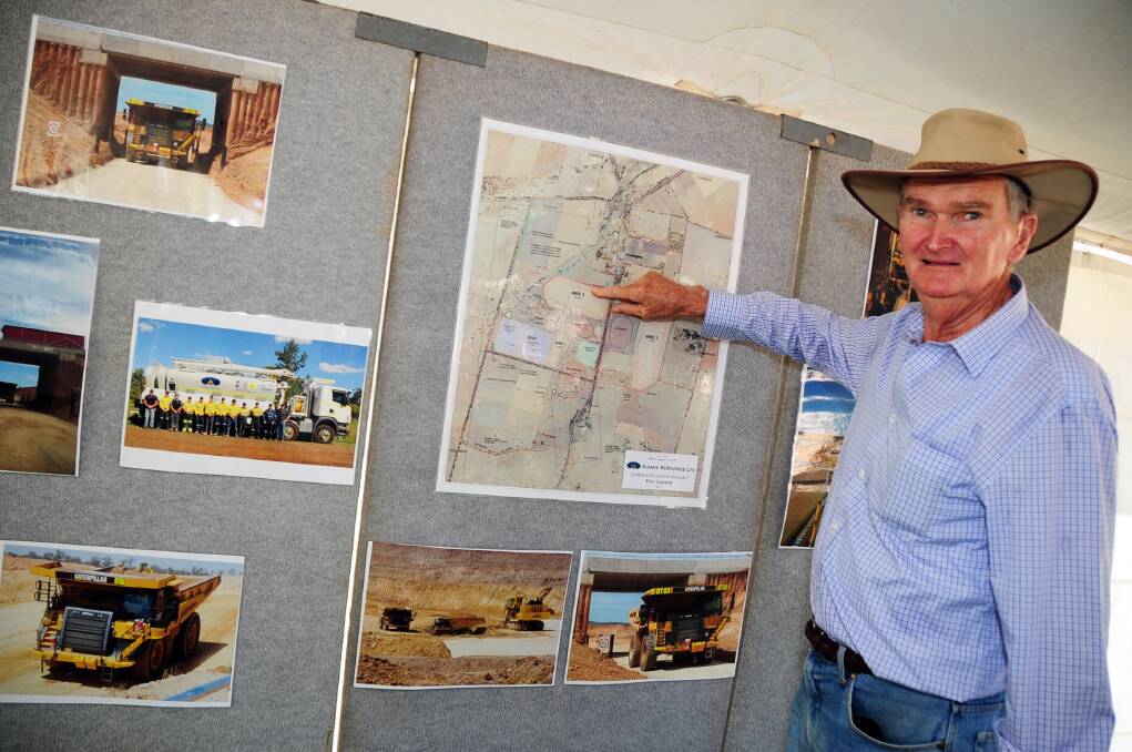 John McNiven, a former owner of the property that has become the Tomingley mine site, checks out a map of it before the official opening by NSW Minister for Resources and Energy Anthony Roberts.