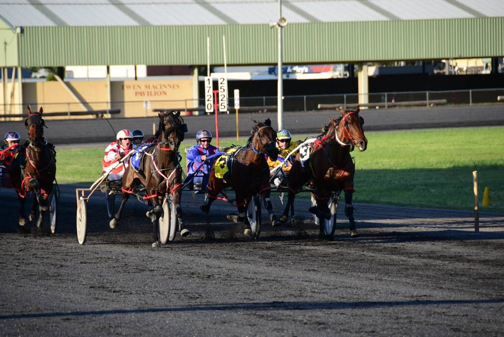 Smokin Bopper s drought-breaking victory was one of three wins for Nathan Hurst (red and white) on Wednesday night. 	Photo: CHERYL BURKE