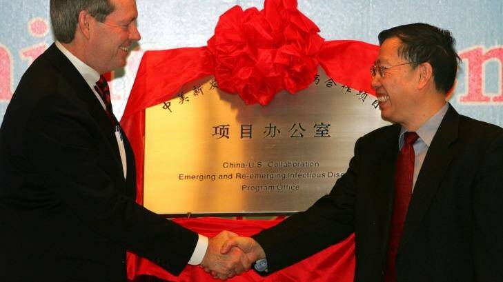 Then Chinese vice-minister of health, Huang Jiefu, right, during the opening of a Sino-US collaborative office at the Chinese Centre for Disease Control in 2006. Photo: Pool