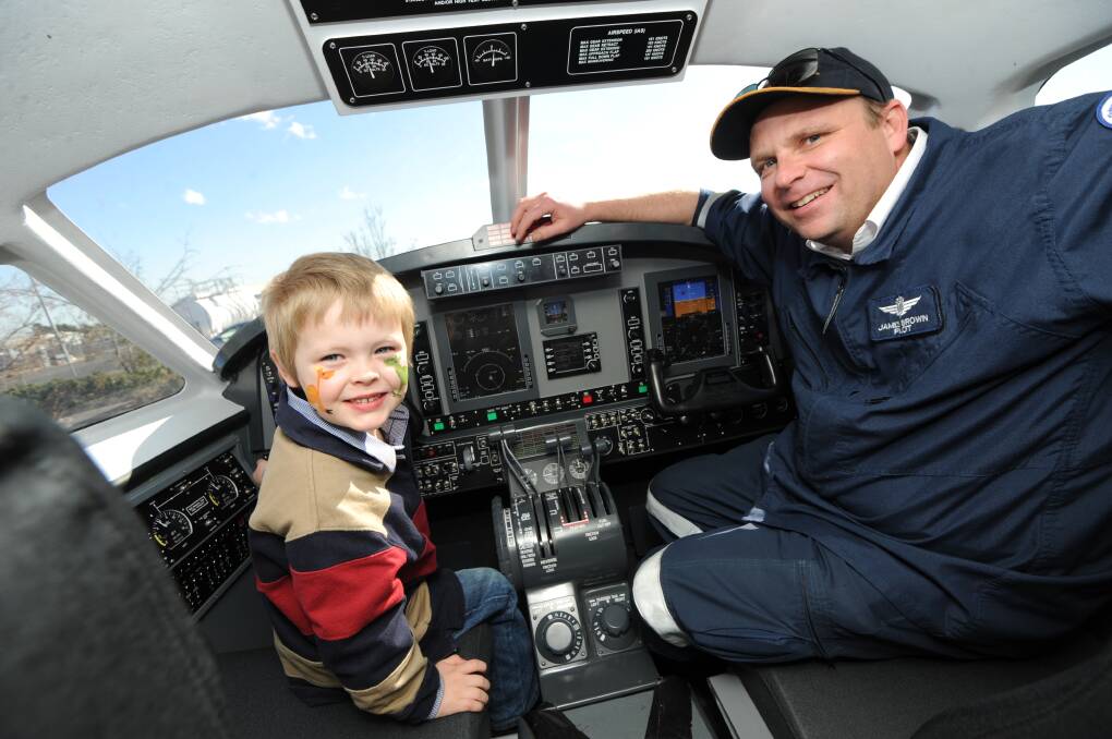 Four-year-old Lawson Brown was delighted to meet Royal Flying Doctors Service pilot James Brown (no relation) and sit in the RFDS simulator.  
Photo: BELINDA SOOLE