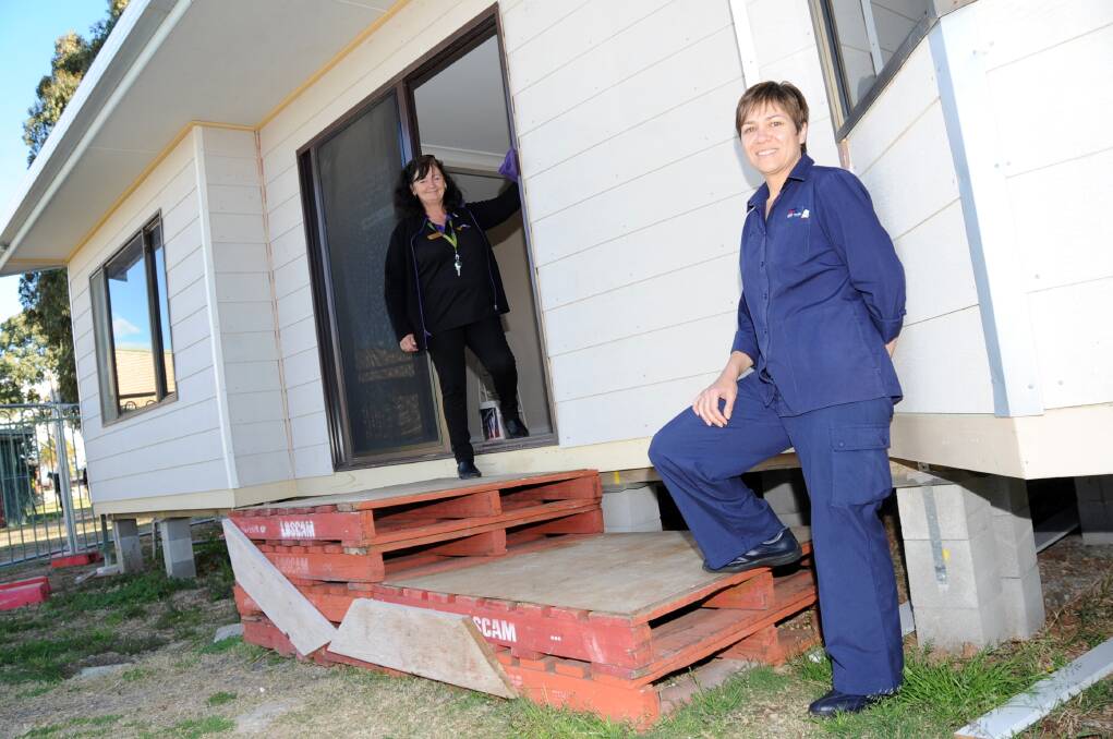 Orana Heights Before and After School Care coordinator Cathy Buckley and OHBASC voluntary project manager Kellyann Johnson in front of their new building, which just needs a ramp to be complete.      Photo: BELINDA SOOLE