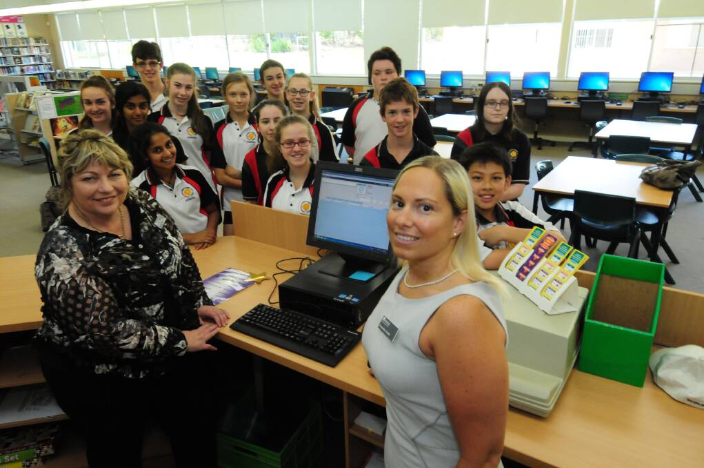 xsel manager Pauline Freeburn and Dubbo College teacher Emmeline Smith (front) with Dubbo College students Lauren Cook, Ashwini Manorathan, Robin Hall, Sarah Wijenaike,Josie Stanger-Jones, Alexandra Lindsay, Sarah Boon, Georgia Benton-Bryant, Piper Kleinig, Abigail Liptrot, Daniel Cook, Angus Wood, Andrew Nguyen and Chloe Hilder. The students are some of the first enrolments in virtual high school Aurora College, set to open in 2015. Photo: GREG KEEN