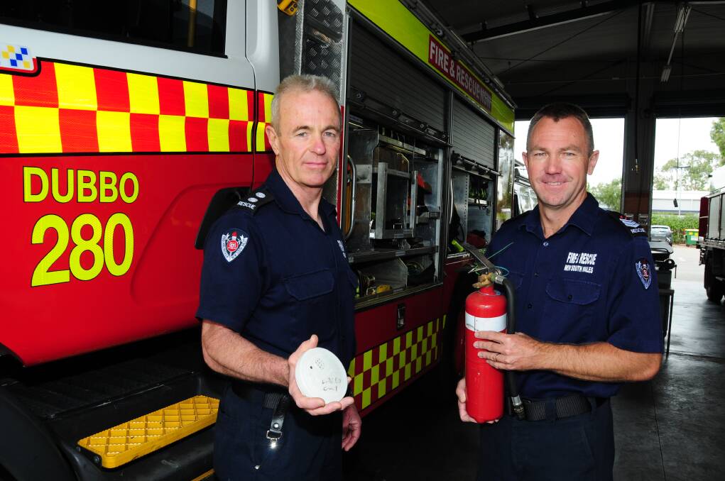 Station commander Mark Weir and senior firefighter Chris Cusack and are urging Dubbo residents to stay safe over the holiday season. Photo: JOSH HEARD