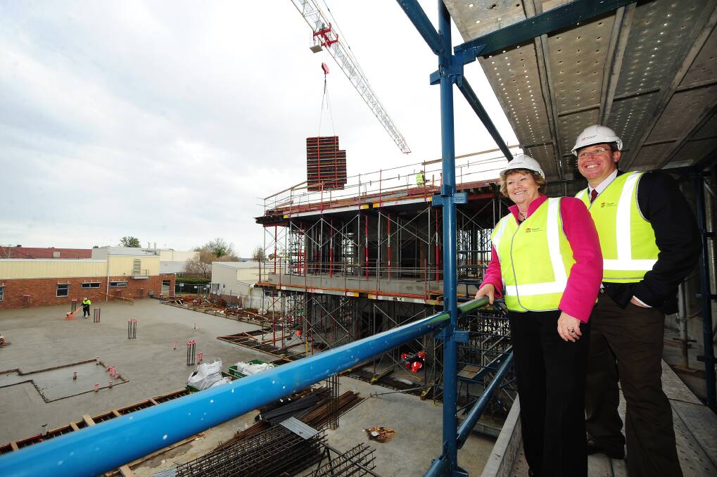 NSW health minister Jillian Skinner and Dubbo MP Troy Grant view work on a concrete pour for the Dubbo Hospital redevelopment. 				       Photo: BELINDA SOOLE