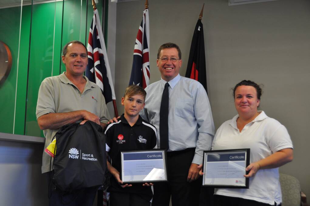 Mark Horton from the Office of Sport and Recreation, Member for Dubbo Troy Grant with Danielle and Rhys French.
