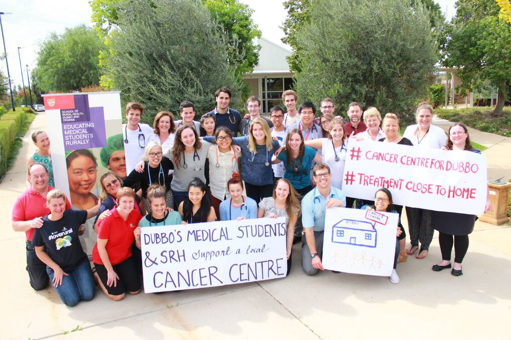 University of Sydney School of Rural Health (SRH) student in Dubbo Lars Newman (front row, second from right) leads fellow students and SRH staff in showing support for an integrated cancer centre in the city. 								 Photo: Contributed