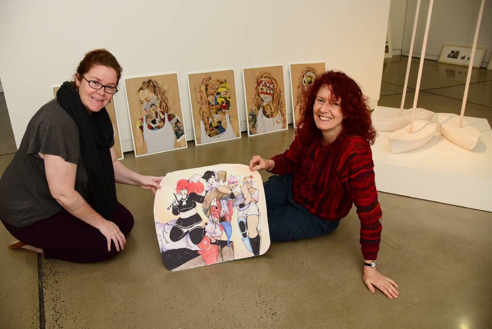 Western Plains Cultural Centre's collections officer, Jessica Moore, and education officer, Karen Hagan, with a selection from the submissions, Pain and Rapture by Lelia Kirkness (front), and Silenced by Emilee Spargo (behind).  Photo: BELINDA SOOLE