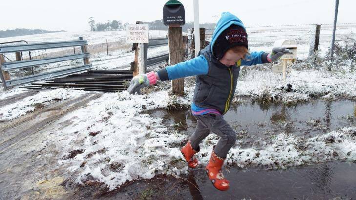 Leon Moir sees snow for the first time at Hampton in the NSW central west. Photo: Nick Moir